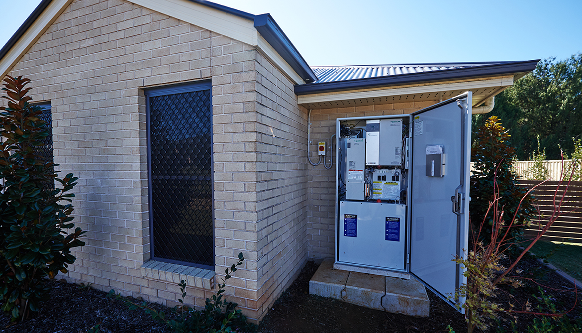 Photo of a battery storage system in a secure housing