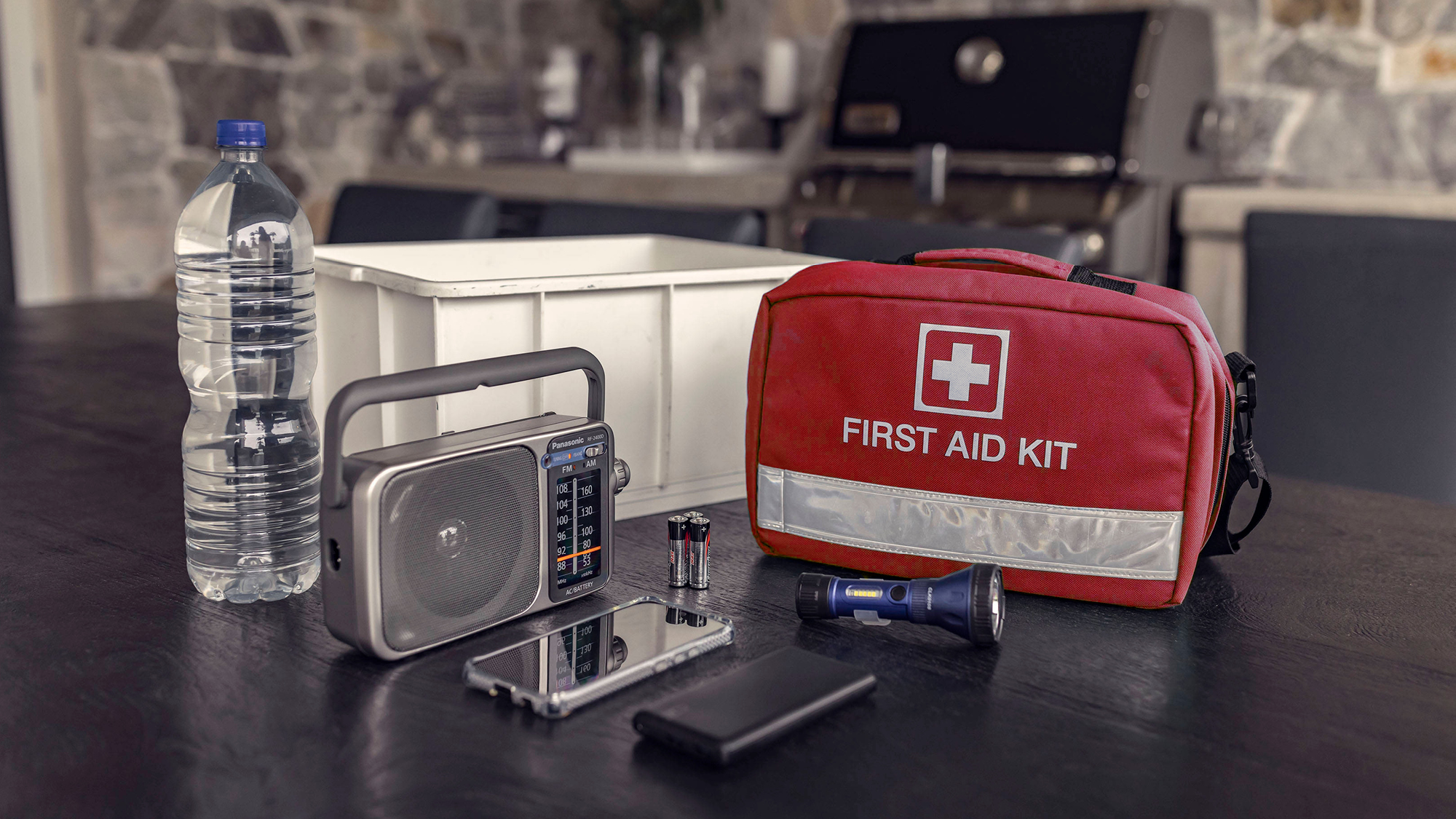 Storm kit of water, radio, phones, torch and first aid kit
