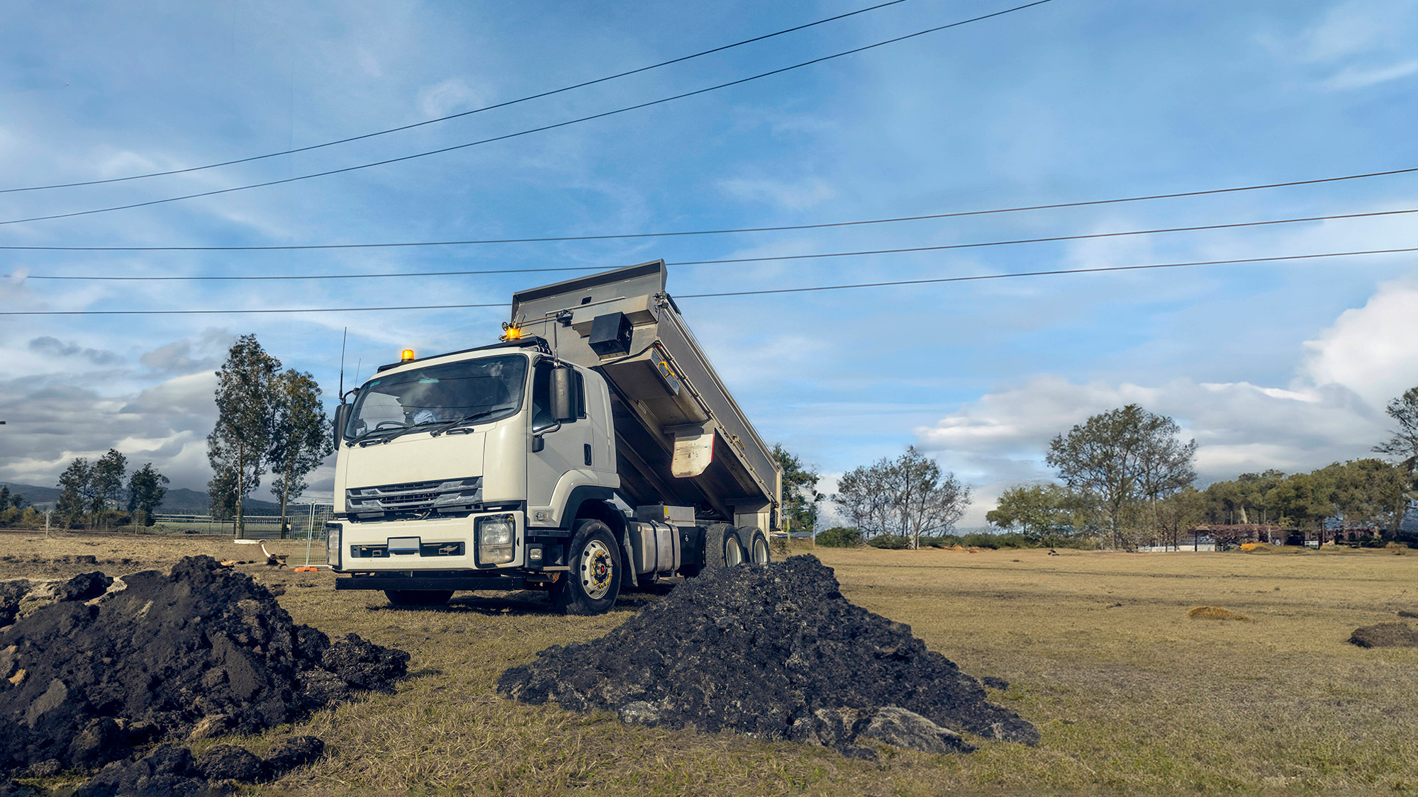 Tip truck touching powerlines