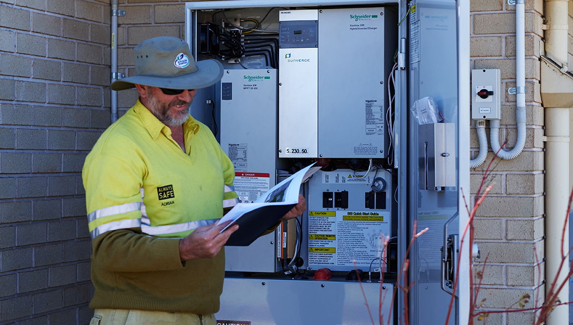 Photo of a qualified person monitoring a battery storage system