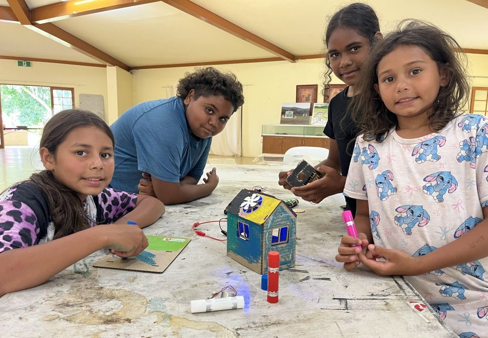 Group of children building doing crafts at a table