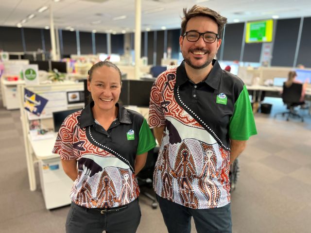 Ergon Energy Retail employees standing in the Townsville call centre
