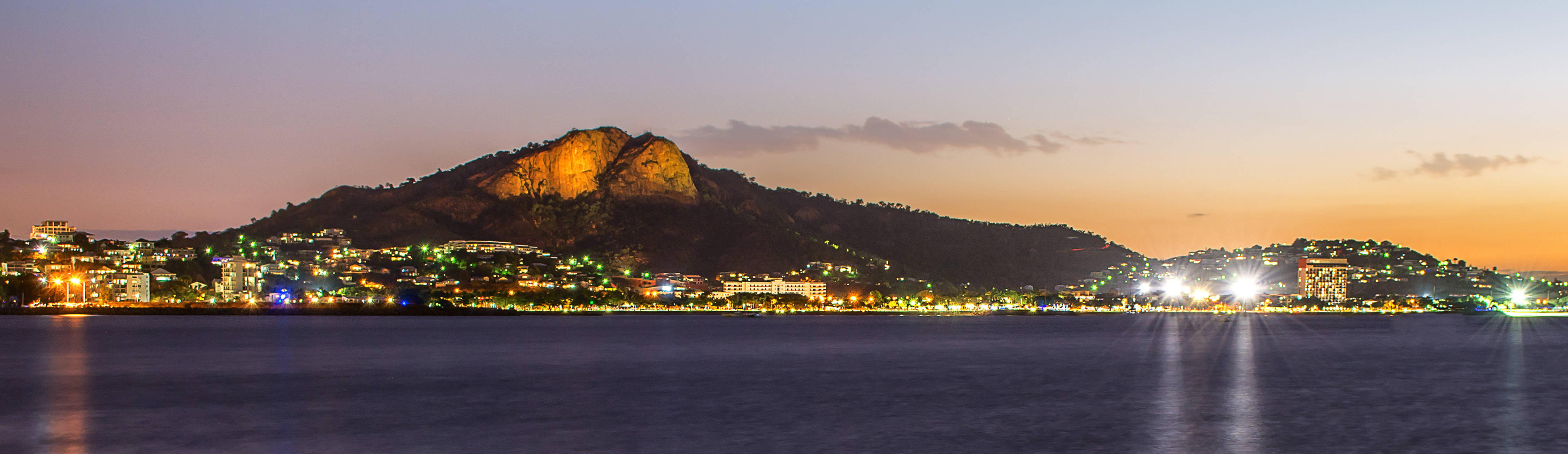 Townsville Strand city view at night with lights and ocean