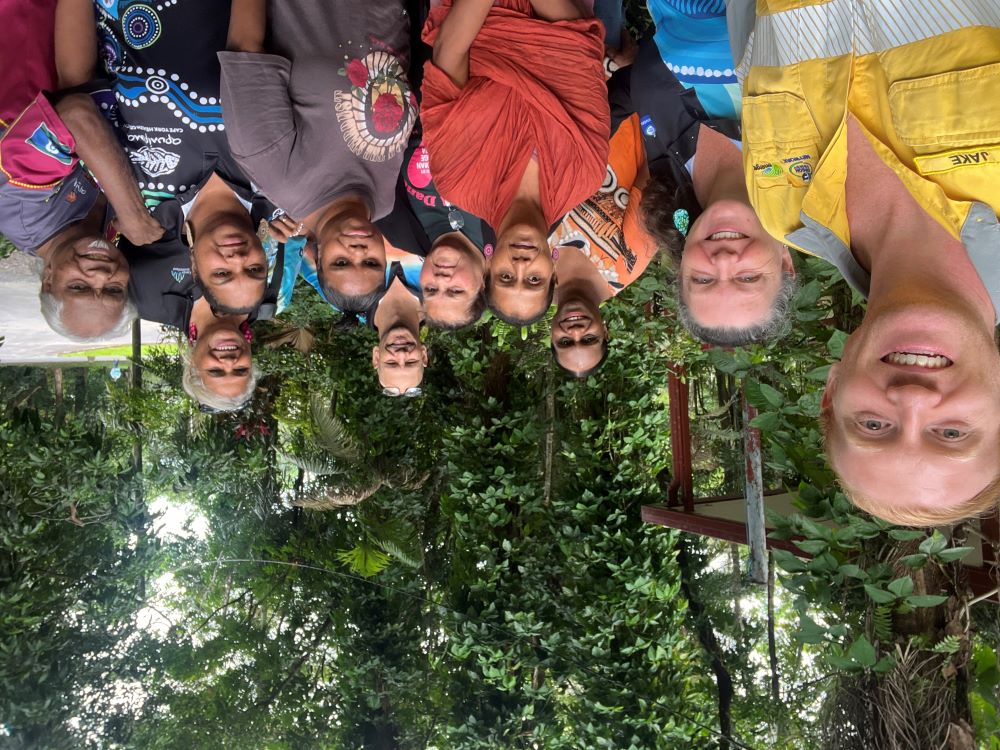 The Bamanga Bubu Ngadimunku Board Directors and community team group photo with rainforest in background