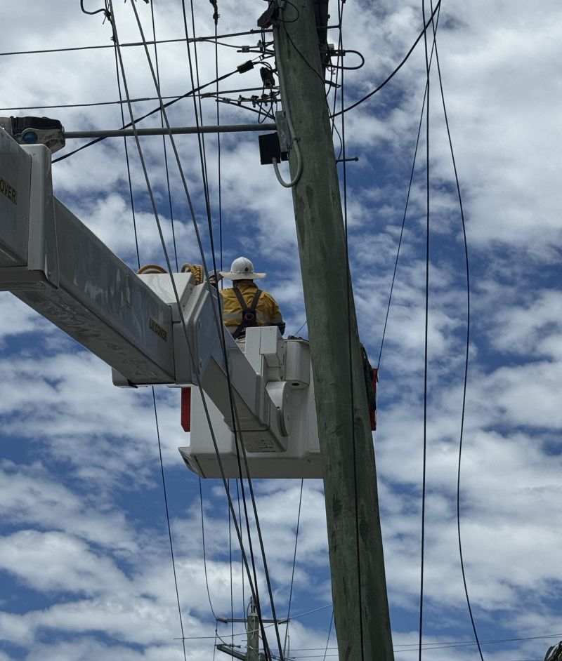 Crew working in bucket truck on Bribie Island