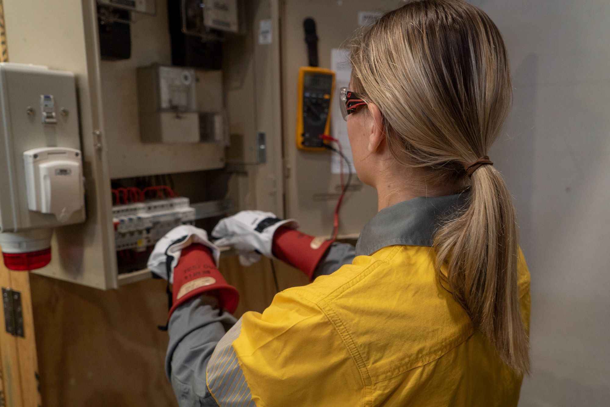 Apprentice testing switchboard