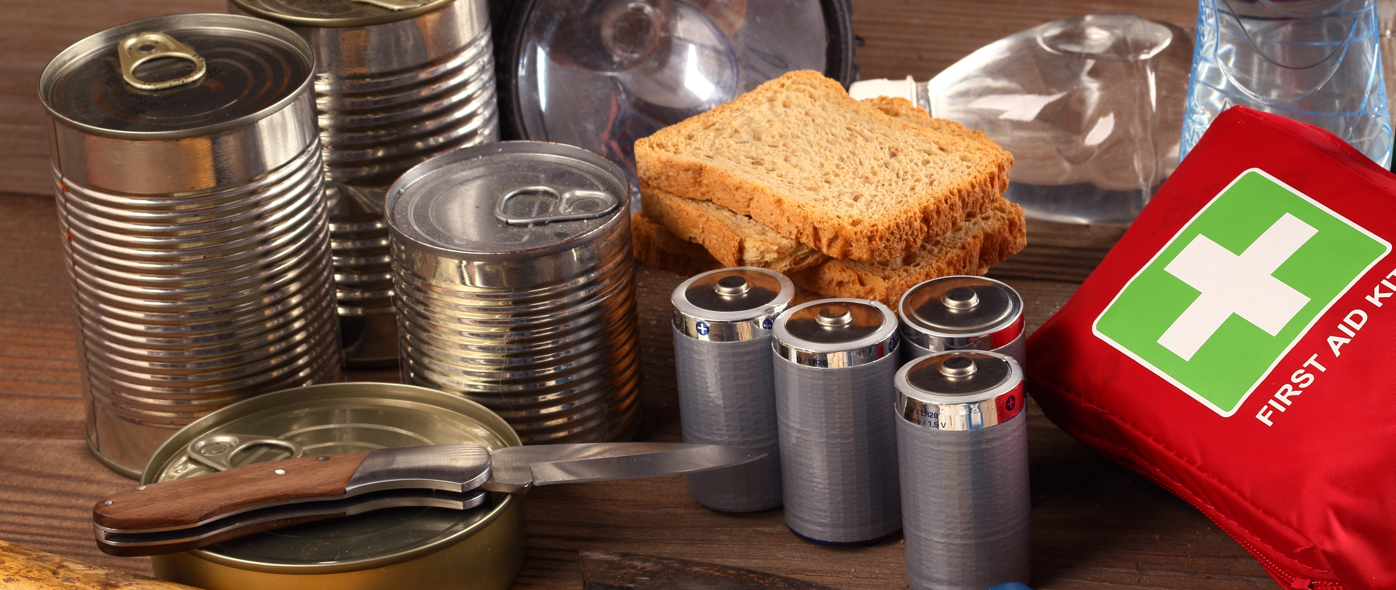 Emergency kit consisting of canned food, batteries, torch and first aid kit