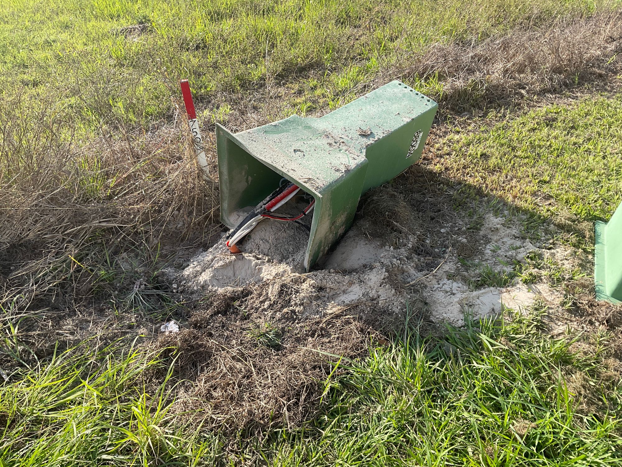 Wires exposed after vehicle hits pillar box