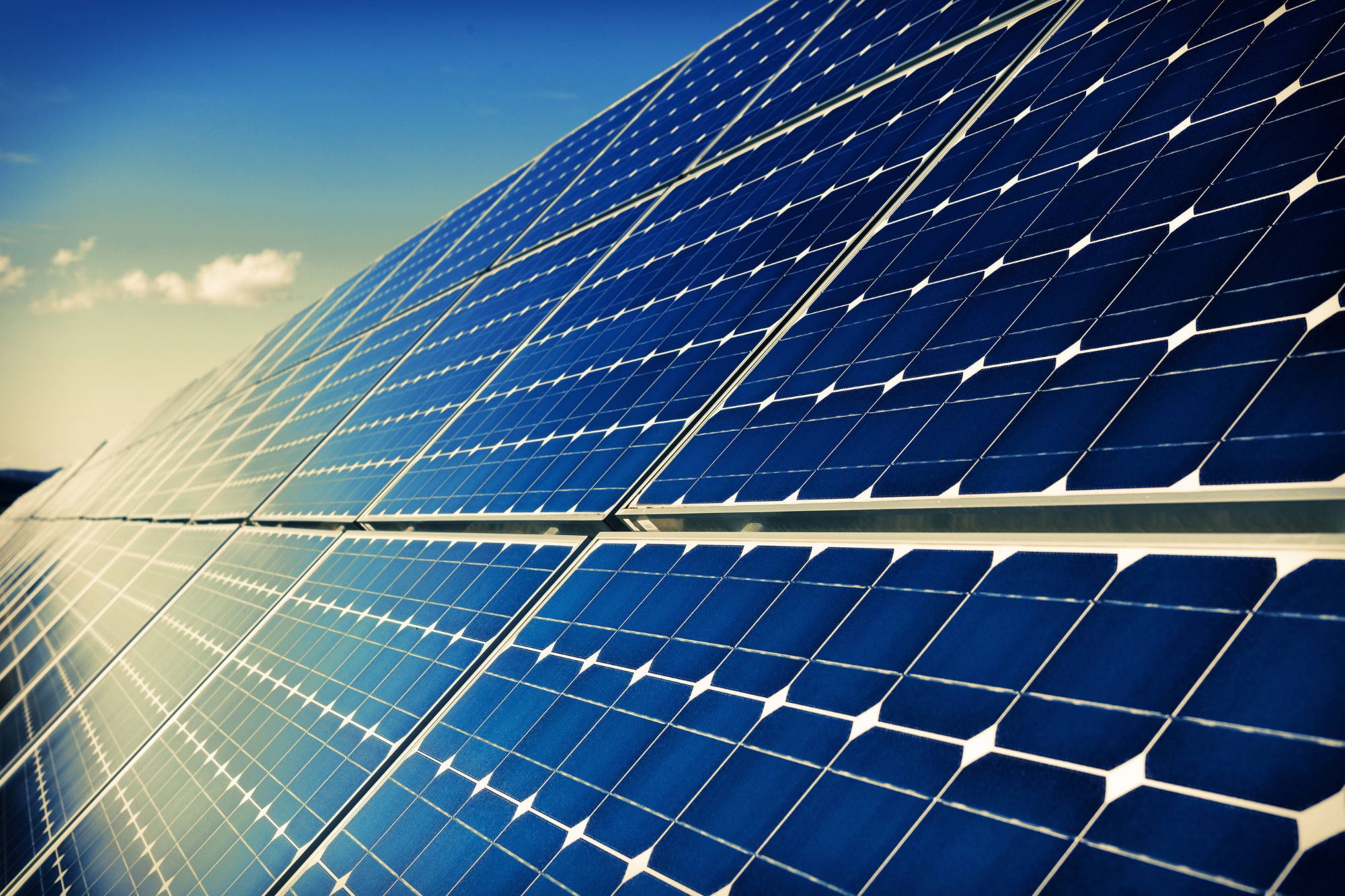 Close up view of solar panels with the sky in background