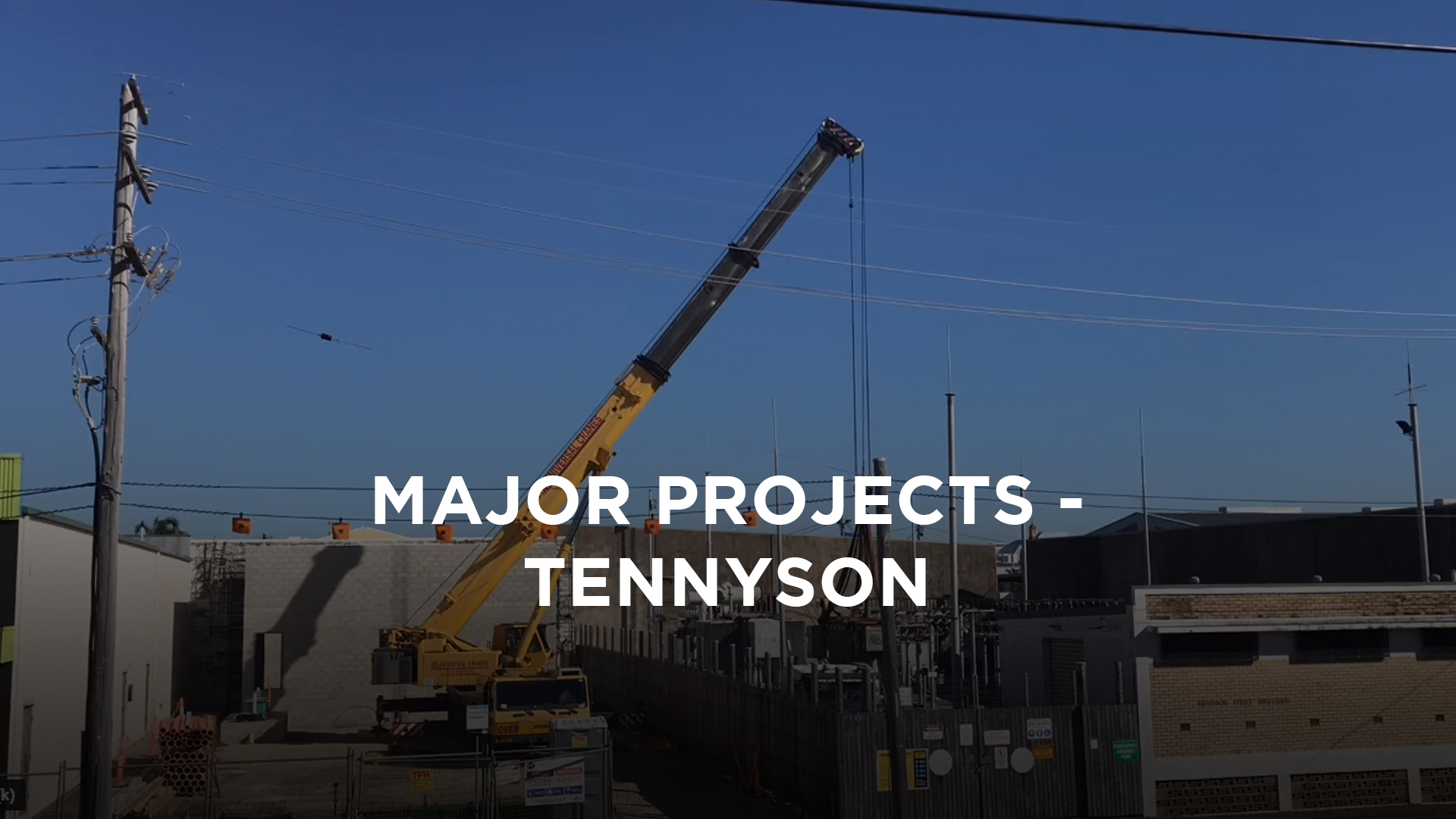 Commercial construction site with a crane lifting building materials