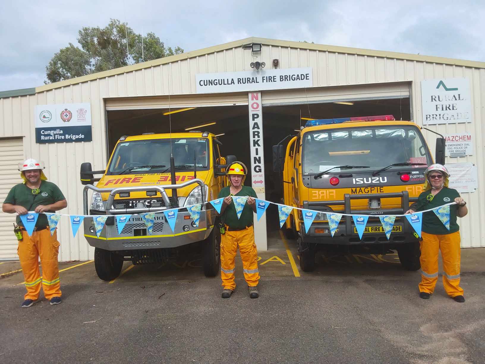 Two workers with a customer as part of community fund